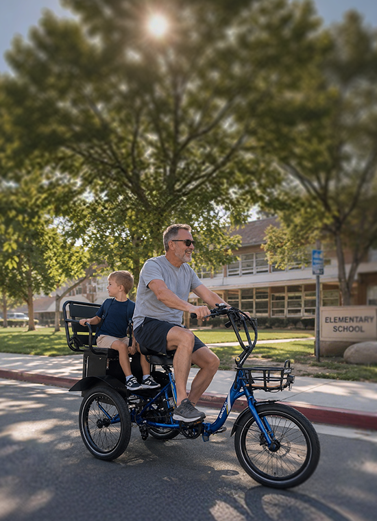 A rider with a child seated in the rear bench of a parent-child trike