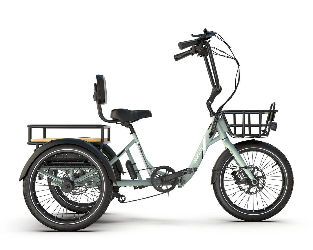 Light green tricycle with a basket on a white background